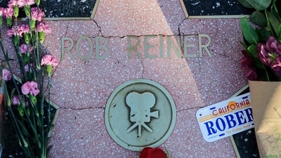 LOS ANGELES, CALIFORNIA - DECEMBER 15: Flowers rest on Rob Reiner's star on the Hollywood Walk of Fame on December 15, 2025 in Los Angeles, California. (Photo by MARIO TAMA / GETTY IMAGES NORTH AMERICA / Getty Images via AFP) (Getty Images via AFP) LOS ANGELES, CALIFORNIA - DECEMBER 15: Flowers rest on Rob Reiner's star on the Hollywood Walk of Fame on December 15, 2025 in Los Angeles, California. (Photo by MARIO TAMA / GETTY IMAGES NORTH AMERICA / Getty Images via AFP) (Getty Images via AFP)
