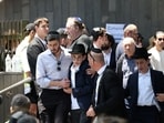 Family members leave the funeral of Rabbi Eli Schlanger, who was killed during a shooting at a Jewish Hanukkah celebration at Sydney's Bondi Beach on Sunday. 