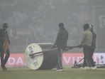 Groundsmen roll the pitch as the India vs South Africa T20I was called off due to foggy weather. (Deepak Gupta / Hindustan Times)