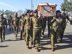 J&K director general of police Nalin Prabhat with other security personnel carries the mortal remains of Special Operations Group cop Amjad Ali Khan, who was killed during a gunfight with terrorists, in Udhampur district. (PTI)