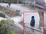 The person of interest in connection with the December 13, 2025 shooting at Brown University, in Providence, Rhode Island, U.S., walks around.