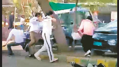 A grab from the viral video which shows the driver of a Mahindra Scorpio trying to run over students in MDU on Tuesday. (Video grab) A grab from the viral video which shows the driver of a Mahindra Scorpio trying to run over students in MDU on Tuesday. (Video grab)