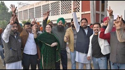 AAP candidate Harpreet Kaur Grewal (in green suit) from Bholapur village along with party supporters showing the victory sign after registering a win in the rural body polls in Ludhiana on Wednesday. (Gurpreet Singh/HT) AAP candidate Harpreet Kaur Grewal (in green suit) from Bholapur village along with party supporters showing the victory sign after registering a win in the rural body polls in Ludhiana on Wednesday. (Gurpreet Singh/HT)