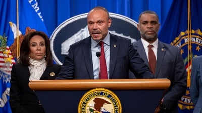 Deputy FBI Director Dan Bongino (C) speaks during a news conference at the Department of Justice (AFP) Deputy FBI Director Dan Bongino (C) speaks during a news conference at the Department of Justice (AFP)