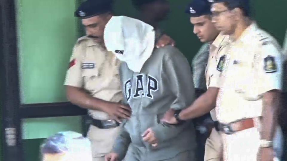 One of the Luthra brothers, co-owners of the Birch by Romeo Lane nightclub, being taken by police personnel to a court (PTI videos/Screengrab)