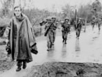 Associated Press correspondent Peter Arnett, left, marches with Vietnamese troops in Vietnam, Nov. 11, 1965.(AP/ File)