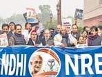 Opposition leaders raise slogans during a protest at the Parliament House complex amid its ongoing Winter session, in New Delhi, Thursday. (PTI) Opposition leaders raise slogans during a protest at the Parliament House complex amid its ongoing Winter session, in New Delhi, Thursday. (PTI)