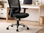 A clean work-from-home setup showing a revolving office chair that moves easily between desk, shelves, and everyday tasks without breaking focus.(AI generated)