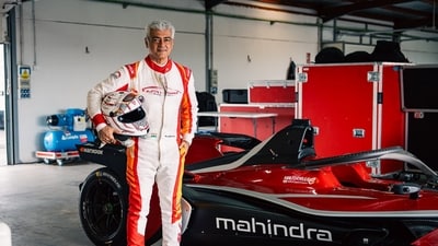 Ajith Kumar with the Formula E car made by Mahindra in Spain. Ajith Kumar with the Formula E car made by Mahindra in Spain.