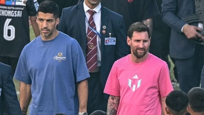 Argentina's footballer Lionel Messi (C), along with Uruguayan footballer Luis Suarez (L) (AFP) Argentina's footballer Lionel Messi (C), along with Uruguayan footballer Luis Suarez (L) (AFP)