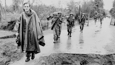 Associated Press correspondent Peter Arnett, left, marches with Vietnamese troops in Vietnam, Nov. 11, 1965. (AP/ File) Associated Press correspondent Peter Arnett, left, marches with Vietnamese troops in Vietnam, Nov. 11, 1965. (AP/ File)