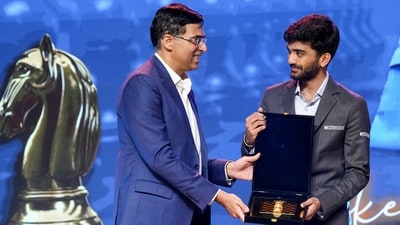 World Chess Champion D Gukesh, center, being felicitated with a memento by former world chess champion Viswanathan Anand. (PTI) World Chess Champion D Gukesh, center, being felicitated with a memento by former world chess champion Viswanathan Anand. (PTI)