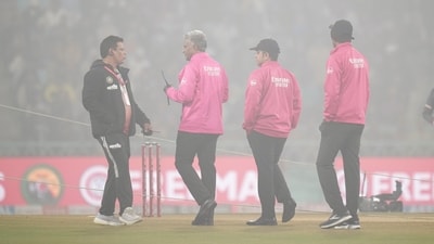 Umpires inspect the visibility at the Ekana Cricket Stadium. (PTI) Umpires inspect the visibility at the Ekana Cricket Stadium. (PTI)