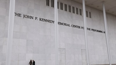 People walk along the front of the John F. Kennedy Center for the Performing Arts, after the Kennedy Center board decided to rename the institution the Trump-Kennedy Center in Washington, D.C., U.S., December 18, 2025. REUTERS/Kevin Lamarque
