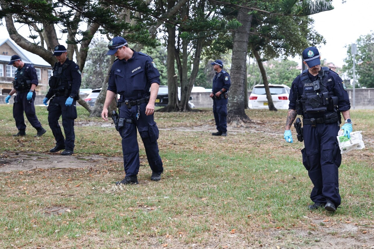 Police search for evidence near the site of the Bondi Beach shooting. Police search for evidence near the site of the Bondi Beach shooting.