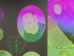 Images of the shooter at Brown University, identified by authorities as Claudio Neves Valente, are displayed during a press conference