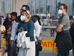 People wearing masks around Kartavya Path as a layer of toxic smog engulfs the area.
