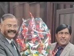 Former UP DGP Prashant Kumar (left) taking charge as the new chairman of UPESSC in Prayagraj on December 19. (HT photo)