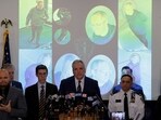 Press conference on Brown University shooter with Claudio Manuel Nueves Valente's photo seen in the backdrop.