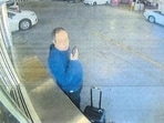 Claudio Neves Valente, suspect in the Brown University shooting in Providence, Rhode Island, picks up a vehicle at an Alamo Rent a Car in this frame grab from CCTV released in an affidavit by the Providence Police December 18, 2025. 