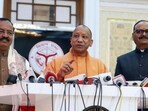 Uttar Pradesh chief minister Yogi Adityanath during a press conference on the first day of the winter session of the state legislature on Friday. Deputy chief ministers Keshav Prasad Maurya and Brajesh Pathak are seen with him. (REPRESENTATIVE IMAGE)