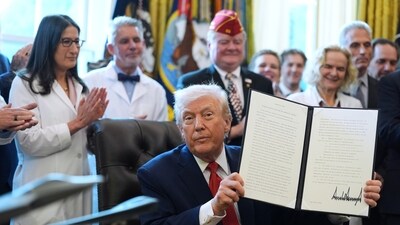 President Donald Trump shows the executive order reclassifying marijuana as a less dangerous drug Thursday, Dec. 18, 2025 (AP Photo/Evan Vucci) (AP) President Donald Trump shows the executive order reclassifying marijuana as a less dangerous drug Thursday, Dec. 18, 2025 (AP Photo/Evan Vucci) (AP)