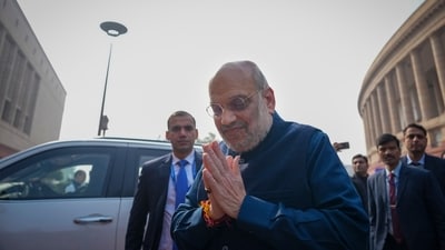 Union home minister Amit Shah reaches the parliament premises on the last day of the winter session. (Ravi Choudhary/PTI)