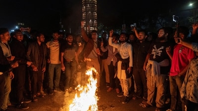 People shout slogans following the death of Sharif Osman Hadi, a student leader who had been receiving treatment in Singapore after being shot in the head, in Dhaka, Bangladesh. (REUTERS)