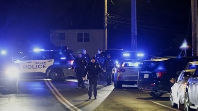 Law enforcement officers seen in the area where the Brown University shooting suspect was reportedly spotted in Salem, N.H. (AP) Law enforcement officers seen in the area where the Brown University shooting suspect was reportedly spotted in Salem, N.H. (AP)