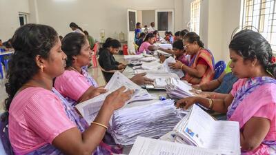 Electoral staff segregate forms of the special intensive revision (SIR) of electoral rolls, in Tirunelveli, Tamil Nadu. (PTI) Electoral staff segregate forms of the special intensive revision (SIR) of electoral rolls, in Tirunelveli, Tamil Nadu. (PTI)