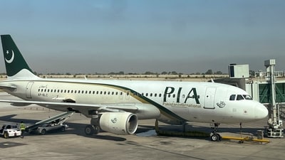 FILE PHOTO: View of a Pakistan International Airlines (PIA) passenger plane, taken through a glass panel, at Islamabad International Airport, Pakistan October 3, 2023. REUTERS/Akhtar Soomro/File Photo (REUTERS)