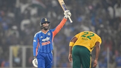 TOPSHOT - India's Tilak Varma (L) celebrates after scoring a half-century (50 runs) during the fifth Twenty20 international cricket match between India and South Africa at the Narendra Modi Stadium in Ahmedabad on December 19, 2025. (Photo by Shammi MEHRA / AFP) / -- IMAGE RESTRICTED TO EDITORIAL USE - STRICTLY NO COMMERCIAL USE -- (AFP) TOPSHOT - India's Tilak Varma (L) celebrates after scoring a half-century (50 runs) during the fifth Twenty20 international cricket match between India and South Africa at the Narendra Modi Stadium in Ahmedabad on December 19, 2025. (Photo by Shammi MEHRA / AFP) / -- IMAGE RESTRICTED TO EDITORIAL USE - STRICTLY NO COMMERCIAL USE -- (AFP)