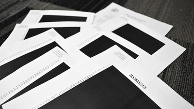 This photo illustration taken in Washington, DC, on December 19, 2025 shows redacted documents after the US Justice Department began releasing the long-awaited records from the investigation into the politically explosive case of convicted sex offender Jeffrey Epstein. (AFP)