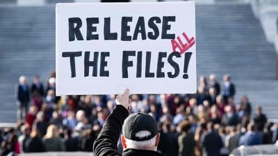 A protester holds a sign related to the release of the Jeffrey Epstein case files outside the US Capitol in Washington, DC. (AFP) A protester holds a sign related to the release of the Jeffrey Epstein case files outside the US Capitol in Washington, DC. (AFP)