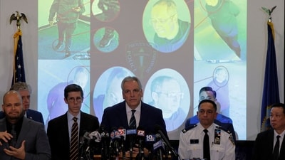 Press conference on Brown University shooter with Claudio Manuel Nueves Valente's photo seen in the backdrop. (REUTERS)