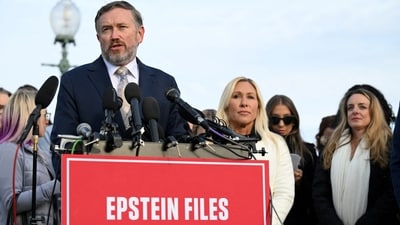 US Representative Thomas Massie (R-KY), accompanied by Representative Marjorie Taylor Greene (R-GA), speaking during a press conference on the Epstein Files Transparency Act. November 18, 2025. (REUTERS)