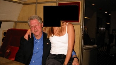 Former US President Bill Clinton and a woman are seen in this image from the estate of late financier and convicted sex offender Jeffrey Epstein, released by the Department of Justice in Washington. (Reuters)