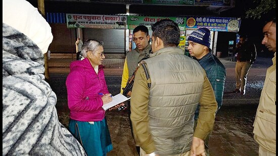 Forensic science laboratory team and Rohtak police at a liquor vend where two gangs fired shots at each other in Ritoli village on Friday evening. (Manoj Dhaka/HindustanTimes)