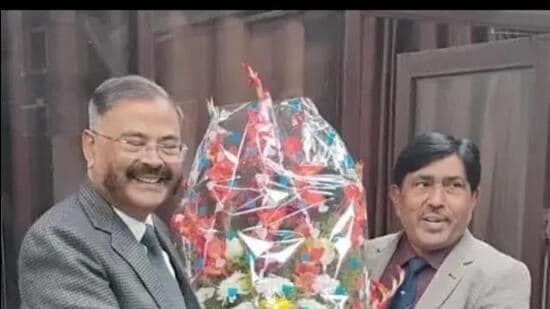 Former UP DGP Prashant Kumar (left) taking charge as the new chairman of UPESSC in Prayagraj on December 19. (HT photo)