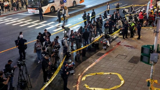 Media members stand outside Eslite Spectrum Nanxi store near Zhongshan station as the entrance of the building is cordoned off with yellow crime scene tape, following an incident in which several were injured after a person released smoke bombs and attacked bystanders, according to the government and local media, in Taipei, Taiwan, December 19, 2025.(REUTERS)