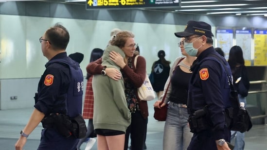 This picture taken and released by Taiwan's Central News Agency (CNA) on December 19, 2025 shows police patrolling at a metro station in Taipei, after attacks at two stations in the city. Attacks at metro stations in Taipei on December 19 involving smoke bombs and stabbing killed at least two people, a fire department official told AFP, adding that the suspect was also dead.&nbsp;(AFP)