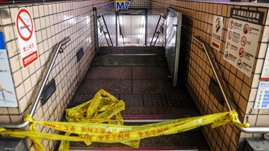This picture taken and released by Taiwan's Central News Agency (CNA) on December 19, 2025 shows one of the entrances to Taipei Main Station being cordoned off as it is temporarily closed after an attack at the station. Attacks at metro stations in Taipei on December 19 involving smoke bombs and stabbing killed at least two people, a fire department official told AFP, adding that the suspect was also dead.(AFP)