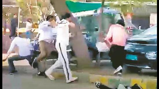 The footage shows a group of students pelting bricks at a Mahindra Scorpio, while the driver is allegedly seen attempting to run over two students outside the university’s law department. (File)