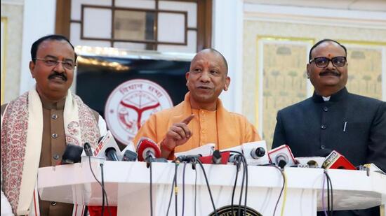 Uttar Pradesh chief minister Yogi Adityanath during a press conference on the first day of the winter session of the state legislature on Friday. Deputy chief ministers Keshav Prasad Maurya and Brajesh Pathak are seen with him. (REPRESENTATIVE IMAGE)