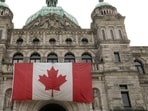 A Canadian flag adorns British Columbia's provincial legislature building in Victoria, British Columbia. (REUTERS)