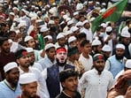 Members of the multiple organisations including Khelafat Majlis join in a protest rally after Friday prayer, demanding justice for the death of Sharif Osman Hadi.