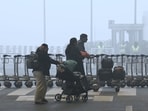 Morning chill and fog engulf the Delhi airport as passengers arrive to board flights. Morning chill and fog engulf the Delhi airport as passengers arrive to board flights.