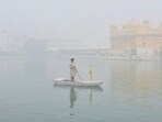 The Golden Temple engulfed in a thick blanket of fog in Amritsar on Friday. (SAMEER SEHGAL/HT)