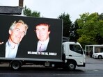 FILE PHOTO: An image of U.S. President Donald Trump alongside disgraced financier Jeffrey Epstein is displayed on a vehicle on the day of the state visit of the U.S. President and first lady Melania Trump, in Windsor, Britain, September 17, 2025. REUTERS/Phil Noble/File Photo