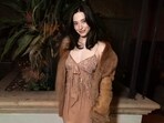 Mikey Madison steps out in archival Dior minidress with fur jacket.(Instagram/andrewmukamal)